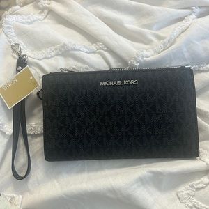Black monogrammed Michael Kors Wallet/Wristlet never used brand new